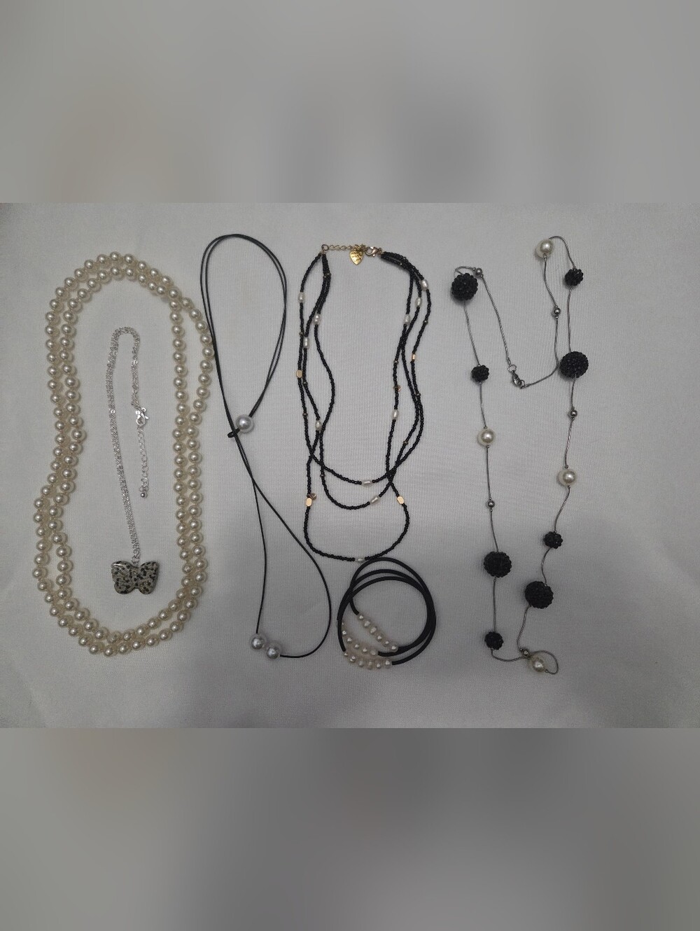 Multi-Strand Black Bead Necklace with Pearl Accents